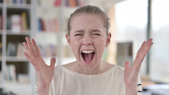 Portrait of Angry Young Woman Shouting, Screaming