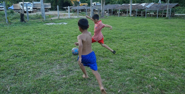 Poor Children Playing Soccer