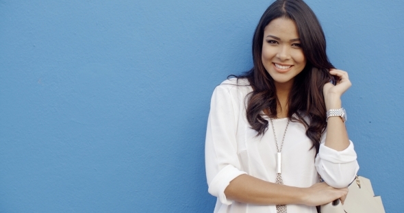 Woman With Accessories Staying Near The Wall alt