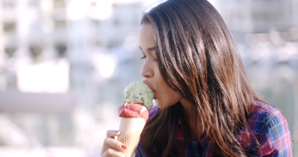 Girl Eating A Delicious Ice Cream