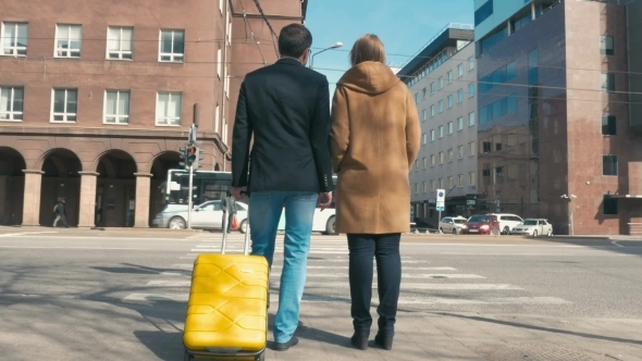 Two People Waiting For Green Traffic Light