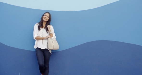 Stylish Cool Girl Against A Blue Wall alt