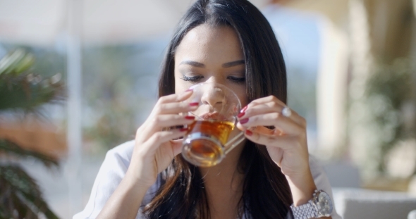 Girl Drinking Tea In Cafe alt