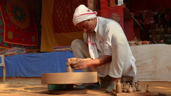 Potter at Work Makes Ceramic Dishes