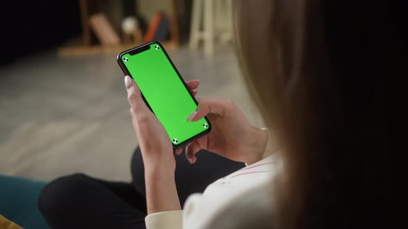 Woman Using Smartphone with Green Screen