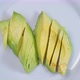 Sliced Avocado Halves On A White Plate Spinning 01 - VideoHive Item for Sale