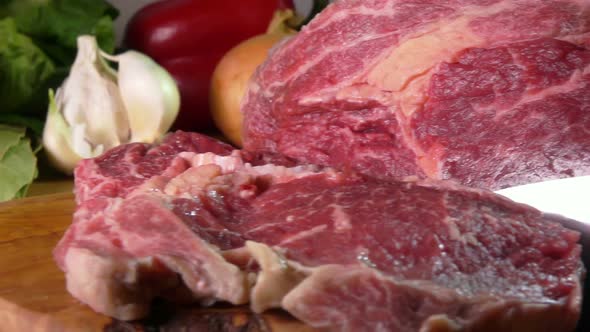 Beef Steak Cut on a Wooden Board