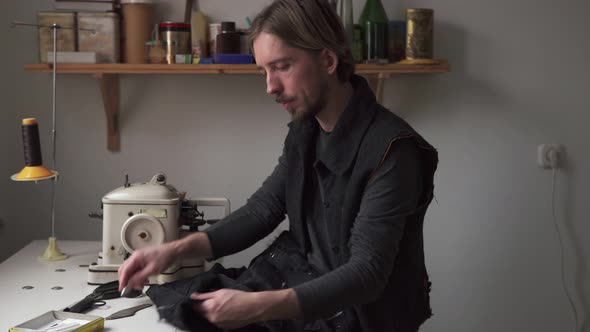 Handsome Man Tailor Working in Sewing Workshop