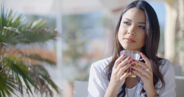 Girl Sitting At Cafe With Cup Of Tea