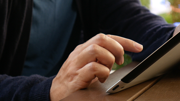 Man Using a Digital Tablet