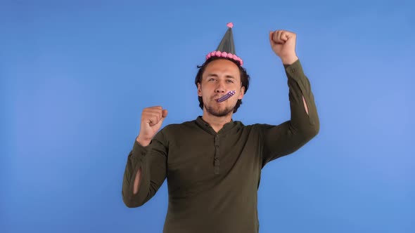 Fellow in Party Hat and Dark Shirt