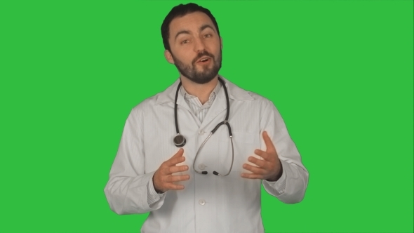 Doctor With Good News Looking On Camera On a Green