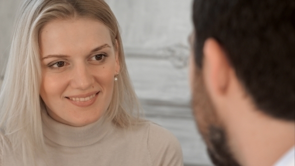 Woman In Doctor's Office Smiling With Good News