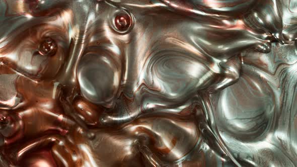 Super Slow Motion Shot of Silver and Bronze Splashing Background at 1000Fps.