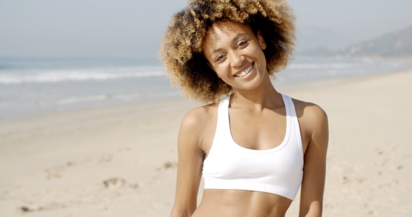 Portrait Of Girl Smiling On Beach