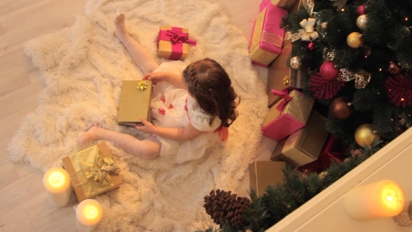 Girl Opening Christmas Gift