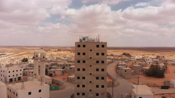 aerial view of big building and mosques in palestine near Gaza at the desert.