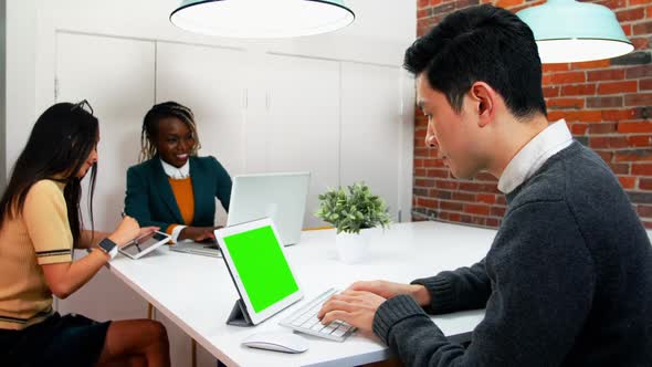 Business executives working at desk