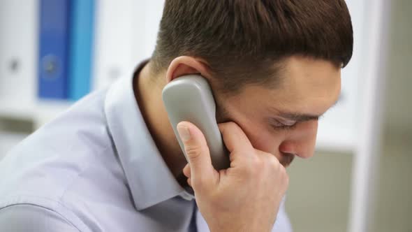 Angry Businessman Calling On Phone At Office 1