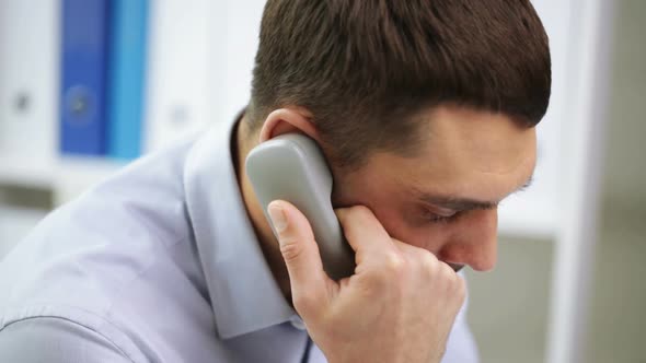 Angry Businessman Calling On Phone At Office 2
