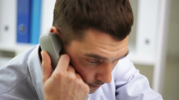 Angry Businessman Calling On Phone At Office 3