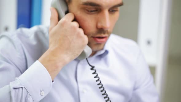 Angry Businessman Calling On Phone At Office 4