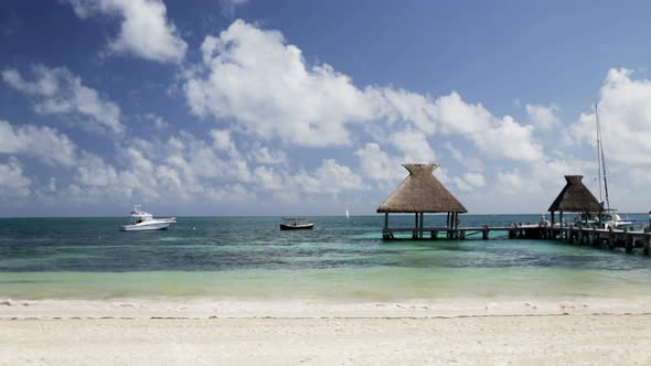 Beach With Wooden Pier And Bungalow 1