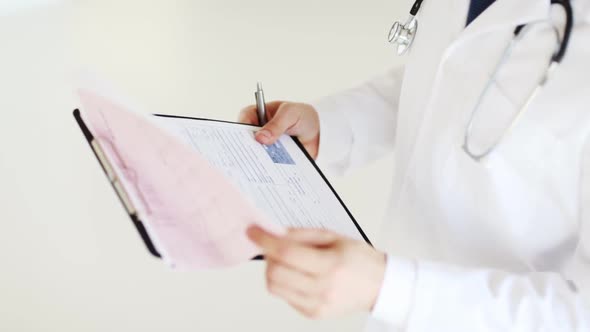 Male Doctor Making A Prescription