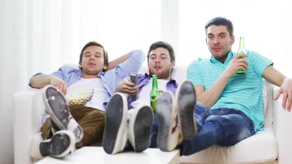 Male Friends With Beer Watching Tv At Home 3