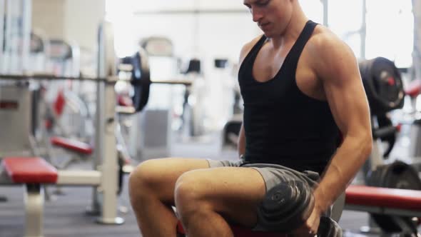 Young Man With Dumbbell In Gym 1