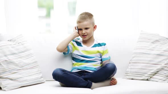 Smiling Schoolboy With Smartphone At Home 2