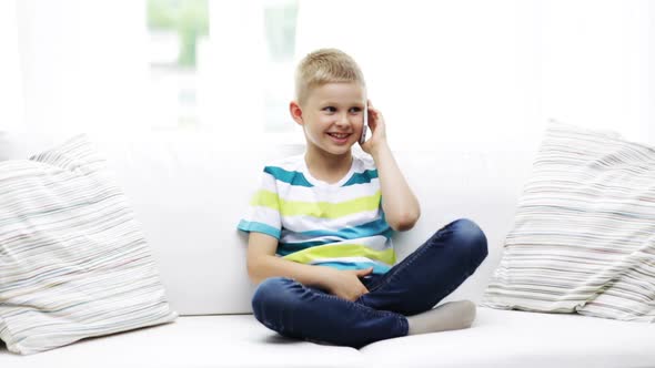 Smiling Schoolboy With Smartphone At Home 3