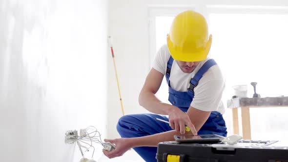 Builder With Tablet Pc And Equipment Indoors 1