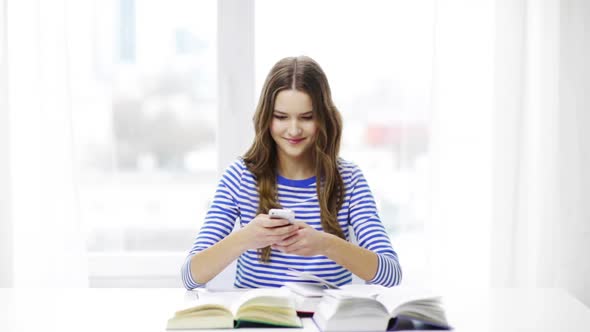 Smiling Student Girl With Smartphone And Books 2