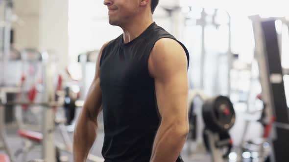 Young Man With Dumbbell In Gym 6 alt