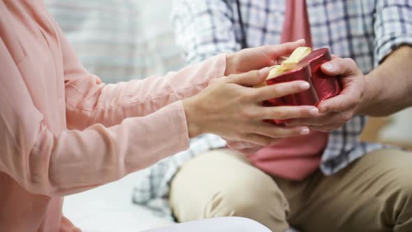 Man Giving Woman Red Heart Shaped Gift Box 1