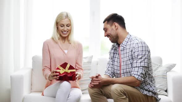 Man Giving Woman Red Heart Shaped Gift Box 3