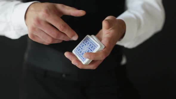 Man Showing Trick With Playing Cards 1