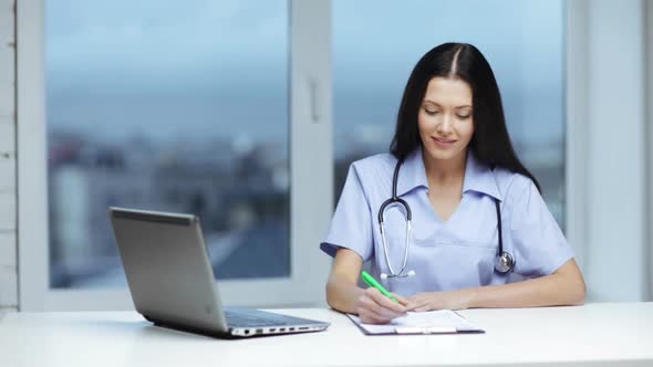 Doctor Or Nurse With Laptop Pc Writing Prescription 2