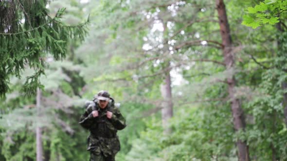 Young Soldier With Backpack In Forest 2