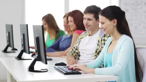 Smiling Students Working With Computers At School 1