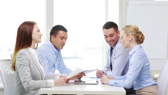 Smiling Team With Table Pc And Papers Working 2