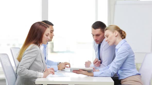 Smiling Team With Table Pc And Papers Working 4