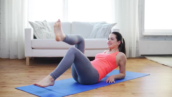 Smiling Teenage Girl Doing Exercise For Legs