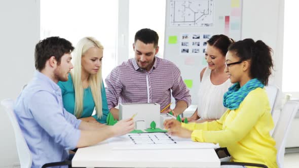 Group Of Smiling Architects Working In Office 2