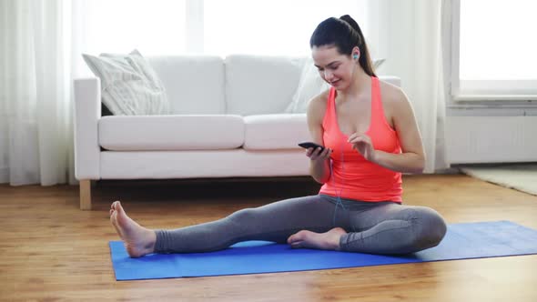 Smiling Teenage Girl Stretching On Mat At Home 1