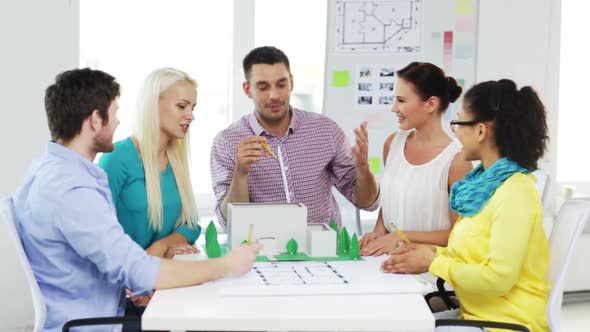 Group Of Smiling Architects Working In Office 4