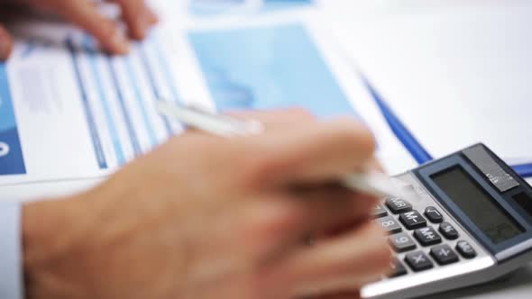 Businessman Hands With Calculator And Papers 1