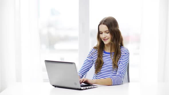 Smiling Teenage Girl With Laptop Computer At Home 1