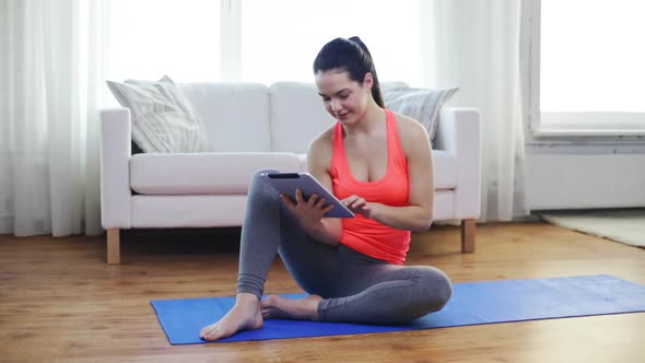 Smiling Teenage Girl With Tablet Pc At Home 1